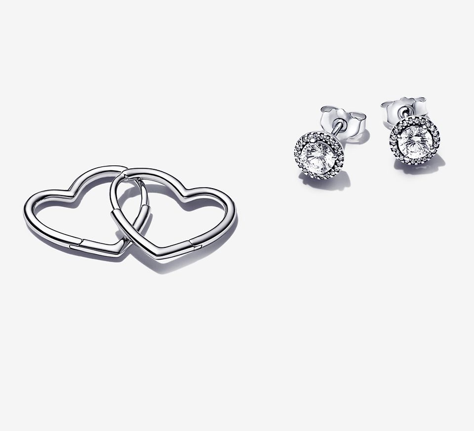 Three types of sterling silver earrings, containing circle stud earrings, heart hoop earrings and round sparkle stud earrings