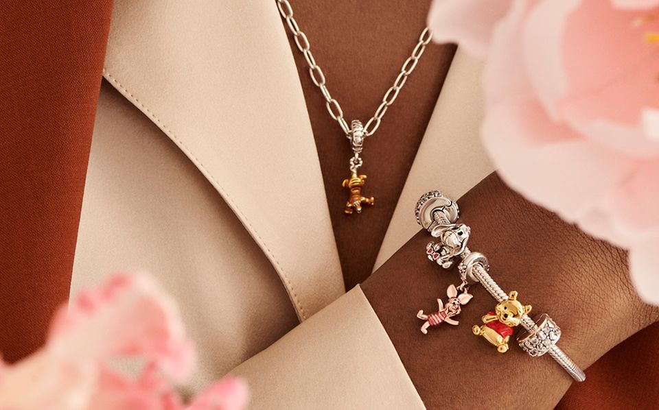 Pandora bracelet and necklace with Disney's Winnie the Pooh charms