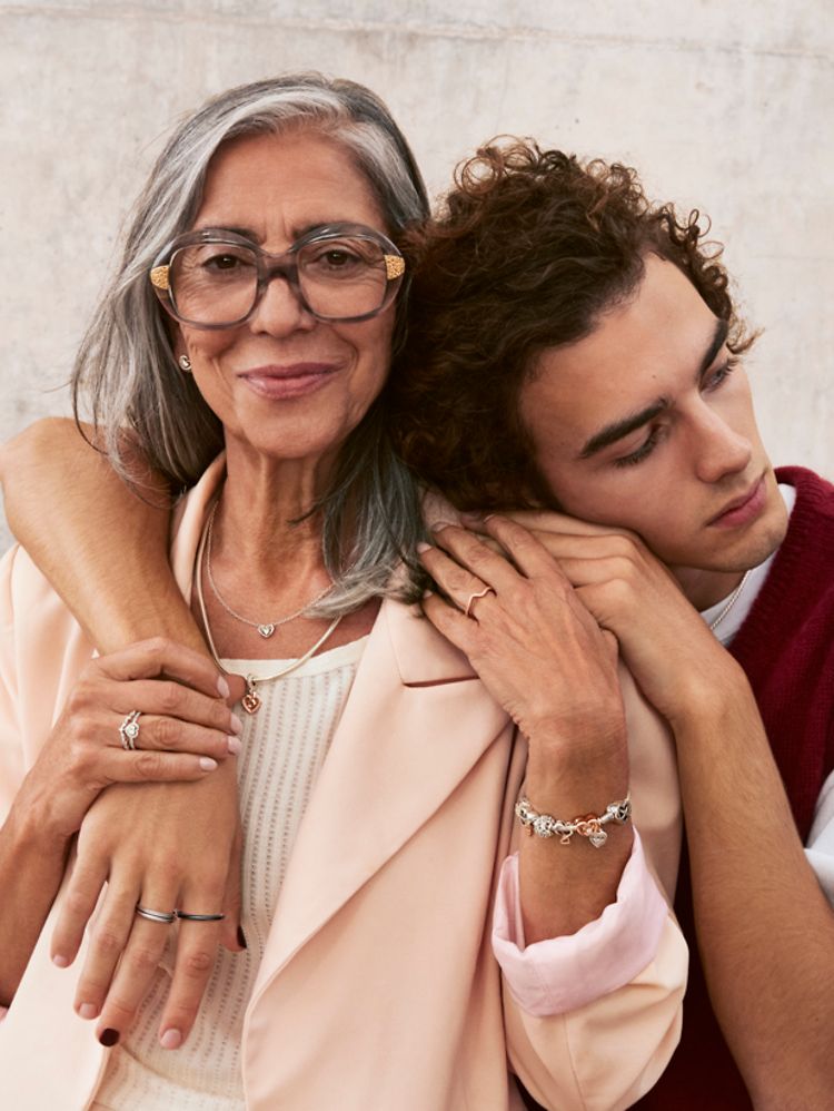 Son embraces mother who is wearing Pandora Mother's Day jewellery
