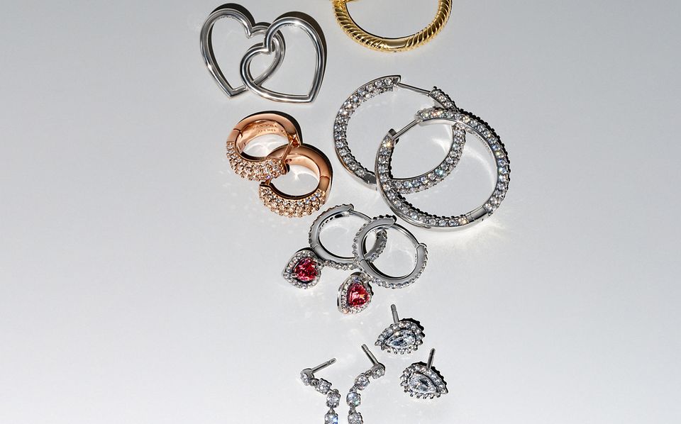 Image of silver, gold and rose gold earrings from pandora BE LOVE